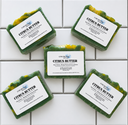 Five bars of Citrus Butter soap from COCOLOND Soapery on a tiled surface