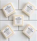 Five bars of COCO Colada soap from COCOLOND Soapery on a tiled surface