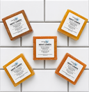 Five bars of Mint Limón soap from COCOLOND Soapery on a tiled surface