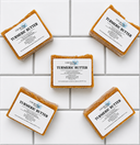 Five bars of Turmeric Butter Fragrance Free soap from COCOLOND Soapery on a tiled surface